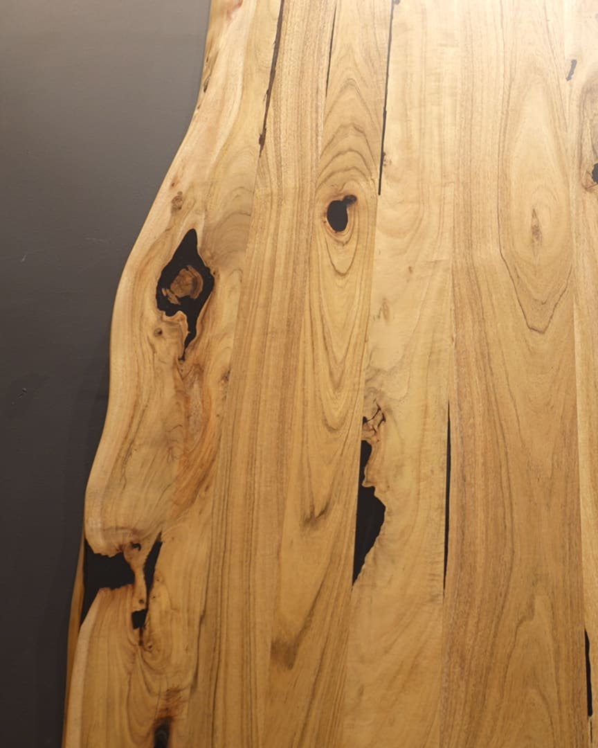 Live-edge solid wood slab, chosen for its grain at the Family Hub factory