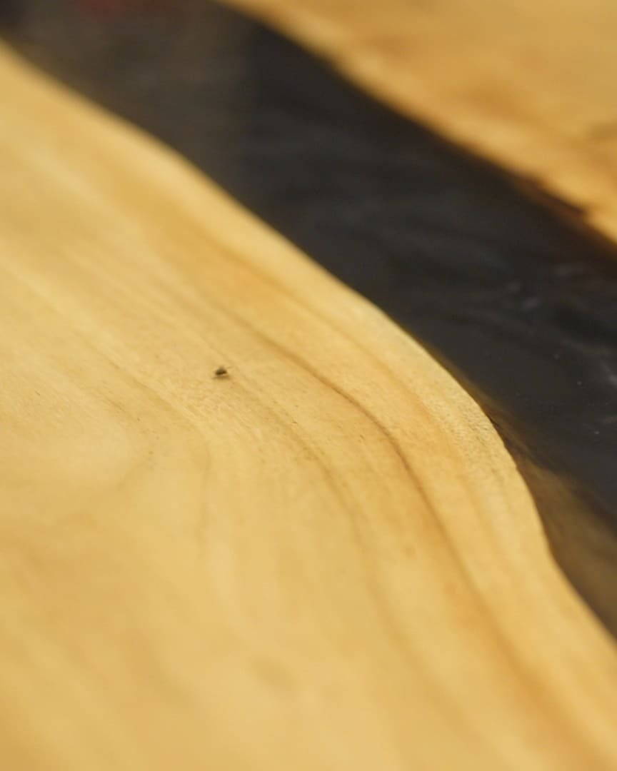 Close-up of a hand-textured wood and resin surface