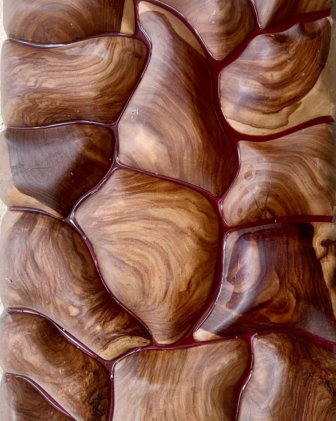 Hand-carved wave texture in solid wood, finished by an artisan at the Family Hub factory in Jodhpur
